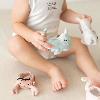 Stephan Baby Boo Bunnie® & Beach Friends
Child playing with plush toys on a light-colored surface