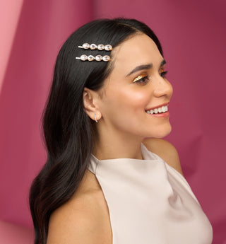 Kitsch Holiday Gemstone Bobby Pins 2pc Set
Woman with a decorative hairpin in her hair against a pink background