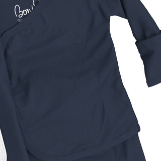 Bonsie Footie - Midnight Blue
Navy blue scrub top with a brand logo on a white background