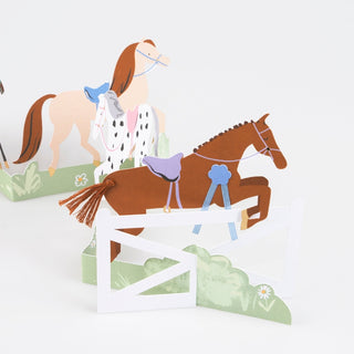 Meri Meri Concertina Horse Birthday Card
Cardboard cutout of a horse and rider with a fence and grass background