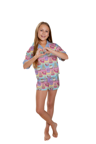 Sunshine Society It's My Party Short Sleeve with Shorts Set 
Young girl wearing a colorful pajama set with a heart gesture on a white background
