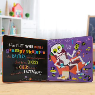 Scholastic Never Touch a Grumpy Bat! Board Book
Open book with a colorful skeleton illustration and text on a wooden surface.