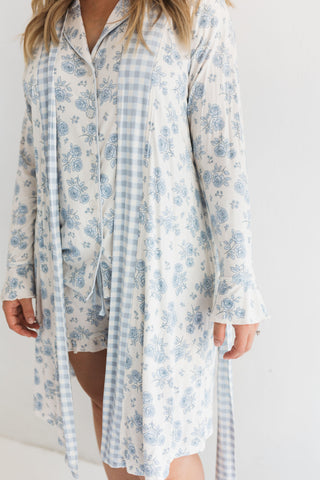 In My Jammers Blue Rose Garden Women's Robe
Woman wearing a blue floral and checkered robe on a white background