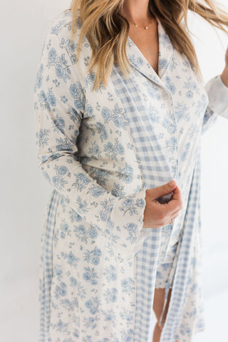 In My Jammers Blue Rose Garden Women's Robe
Woman wearing a floral robe with a plain background
