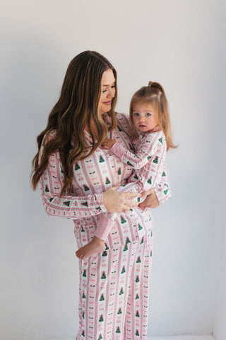 In My Jammers Pinkmas Women’s Set
Woman and child wearing matching pink robes with tree pattern against a white background
