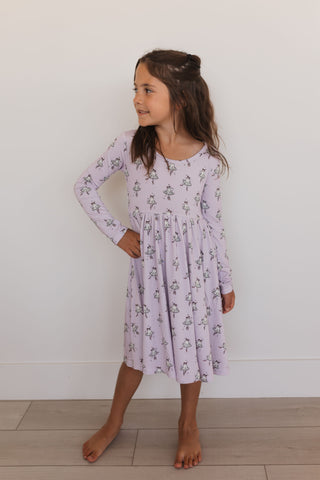 In My Jammers Ballerina Ghost Long Sleeve Twirl Dress Young girl wearing a purple floral dress against a white background
