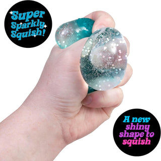 Schylling NeeDoh Groovy Jewel Hand holding a glittery squishy toy with 'Super Sparkly Squish!' text.