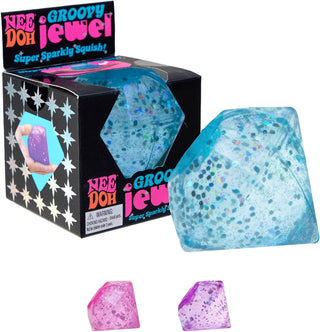 NeeDoh Groovy Jewel Blue and pink glittery gem-shaped toys with packaging labeled 'Nee Doh Groovy Jewel'.