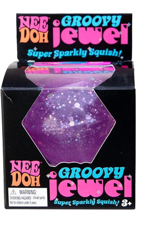 Schylling Purple NeeDoh Groovy Jewel Three packages of Nee Doh Groovy Jewel with pink, blue, and purple colors on a white background.