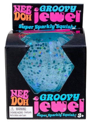 Schylling Blue  NeeDoh Groovy Jewel Three packages of Nee Doh Groovy Jewel with pink, blue, and purple colors on a white background.