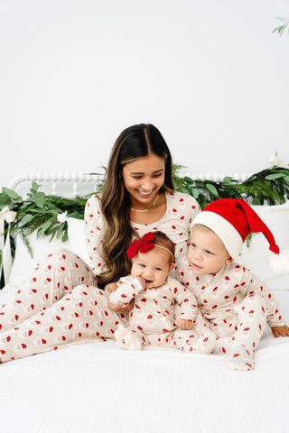 Lou Lou and Company Santa Beanie
Woman and two children in matching pajamas with a Christmas theme on a white background
