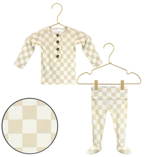 Lou Lou and Company Top and Bottoms - Austin
Checkered baby outfit with shirt and pants on hangers against a white background