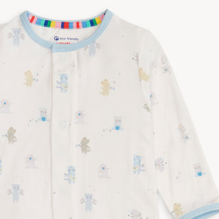 BMagnetic Me Blue Baby Beats Modal Footie aby onesie with teddy bear pattern and rainbow collar on a white background