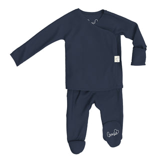 Bonsie Footie - Midnight Blue
Navy blue baby outfit with long-sleeve top and footed pants on a white background