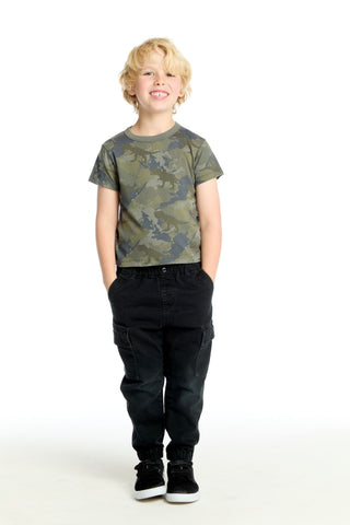 Chaser Dino Camo Tee Child wearing a camouflage t-shirt and black pants on a white background