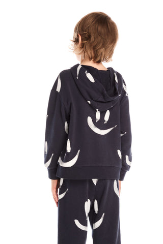 Chaser Smileys Hoodie
Person wearing a navy hoodie with white smiley face patterns on a white background