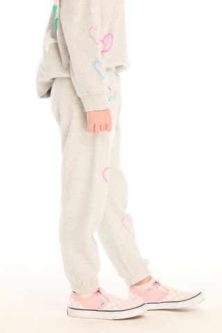 Chaser Winter Love Pants
Person wearing a light gray sweatshirt and pants with colorful heart designs on a white background