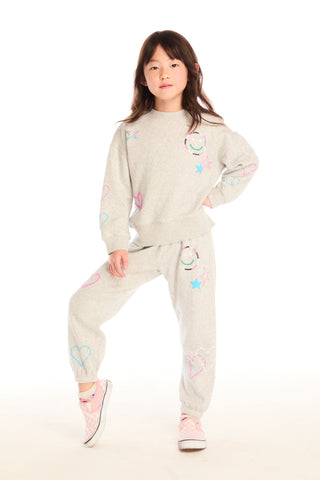 Chaser Winter Love Stitches Long Sleeve
Child wearing a light-colored outfit with colorful designs on a white background