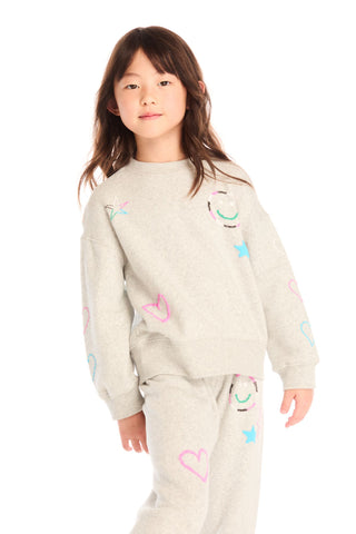 Chaser Winter Love Stitches Long Sleeve
Child wearing a light-colored outfit with colorful heart designs on a white background