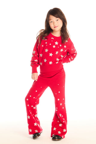 Chaser Danni Rouge Star Pullover
Child wearing red pajamas with white star patterns on a white background