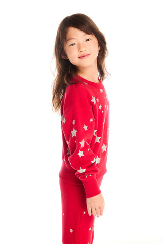 Chaser Danni Rouge Star Pullover
Child wearing a red pajama set with white star patterns on a white background