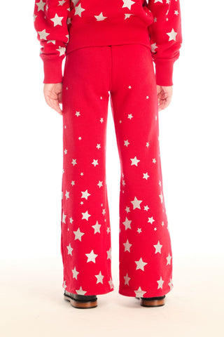 Chaser Tara Rouge Legging
Red outfit with white star patterns on a plain background