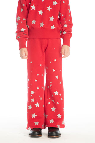Chaser Tara Rouge Legging
Red outfit with star pattern worn by a person on a white background