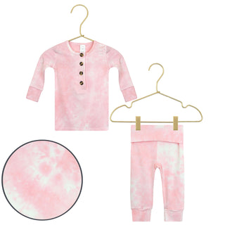 Lou Lou and Company Top and Bottoms - Emily
Pink tie-dye baby outfit with shirt and pants on hangers against a white background.