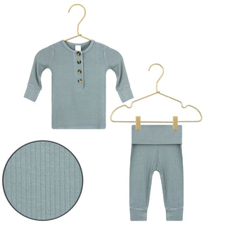 Lou Lou and Company Ribbed Top and Bottoms - Ford
Children's ribbed shirt and pants set on hangers with a close-up of the fabric texture.