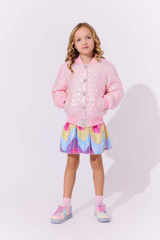 Lola and The Boys I Love You Hologram Jacket
Young girl wearing a pink quilted jacket and colorful skirt on a white background