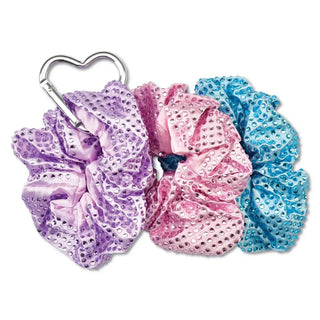Iscream Rhinestone Scrunchie Set
Three sparkly scrunchies in purple, pink, and blue with a silver clip on a white background.