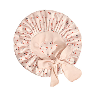 Kitsch Adjustable Oversized Satin Bonnet - Cherry Print
Beige bonnet with cherry pattern on a light gray background