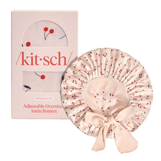 Kitsch Adjustable Oversized Satin Bonnet - Cherry Print
Pink satin bonnet with cherry pattern next to its packaging box on a light gray background