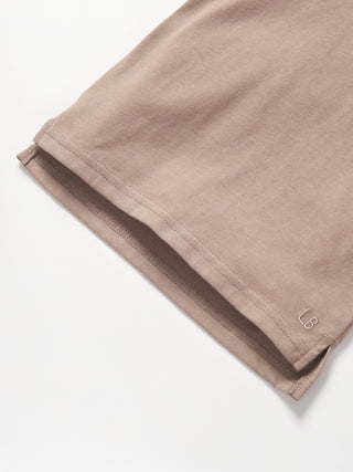 Little Bipsy Elevated Tee - Mushroom
Close-up of beige shorts with a brand logo on a white background