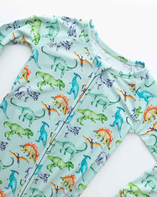 Lev Baby Poppy Convertible Zipper Romper - Landon
Children's shirt with colorful dinosaur pattern on a light blue background