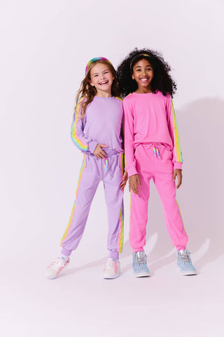 Lola and The Boys Lavender Rainbow Sequin Set Two children wearing colorful tracksuits against a white background