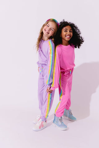 Lola and The Boys Lavender Rainbow Sequin Set Two children wearing colorful tracksuits standing against a white background