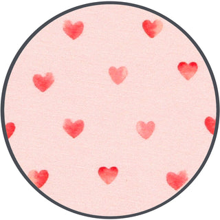 Lou Lou and Company Miley
Round pink rug with red heart patterns on a white background