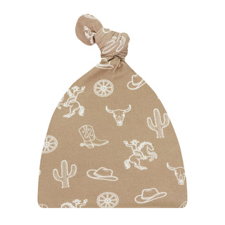 Lou Lou and Company Top Knot Hat - Wyatt 
Beige baby swaddle with white western pattern on a white background