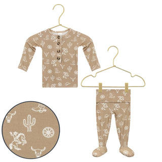 Lou Lou and Company Top and Bottoms - Wyatt
Children's long-sleeve shirt and leggings with cowboy pattern on hangers against a white background.