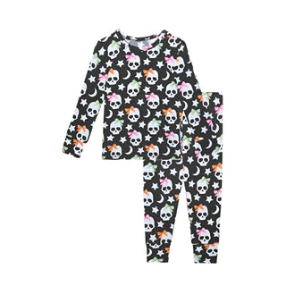Posh Peanut Kelly Skelly Glow in the Dark Classic Pajama Set
Children's pajama set with skull and bow pattern on a white background