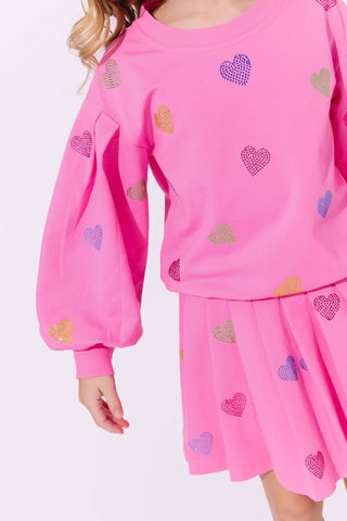 Lola and The Boys Hot Pink Sparkle Hearts Skirt Set
Pink outfit with heart patterns on a plain background