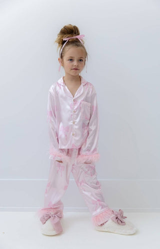 Lola and The Boys Kid's Pretty in Bows Silky Set Child wearing pink pajama set on a white background