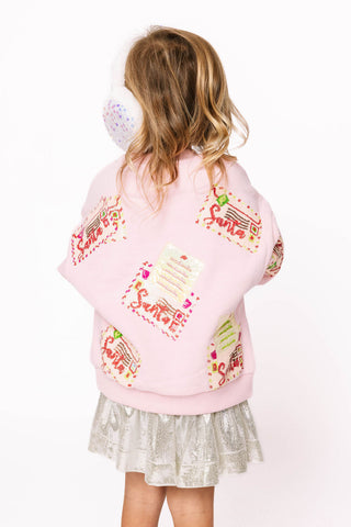 Princess of Sparkles Queen of Sparkles KIDS Letters to Santa - Pink 
Child wearing a pink sweater with colorful designs on a white background