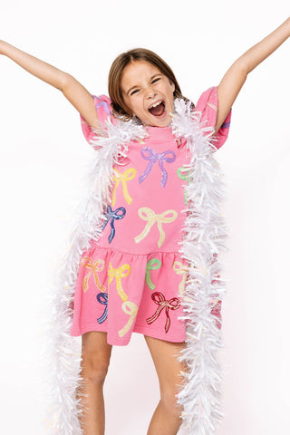 Princess of Sparkles Queen of Sparkles KIDS Sequin Multi Bow With Poof Sleeve Dress
 Child wearing a pink dress with colorful bows and a white feather boa against a white background