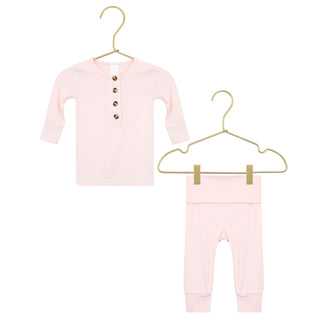 Lou Lou and Company Top and Bottoms - Sophie
Pink baby outfit with a cardigan and pants on gold hangers against a white background