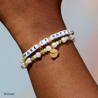 Make It Happen Little Words Project Bracelet - Disney Princess: Tiana
Bracelet with 'MAKE IT HAPPEN' on a wrist, featuring pearls and a gold charm.