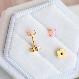 Pierced Co. Pink Opals Earrings
Gold earrings with pink gemstones on a white cloth