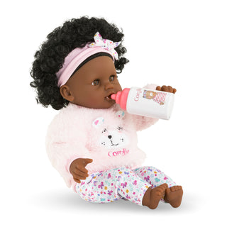 Corolle 12" Doll - Bébé Calin - Caroline
Baby doll with curly hair, pink headband, and bottle, wearing a pink outfit with a teddy bear design.