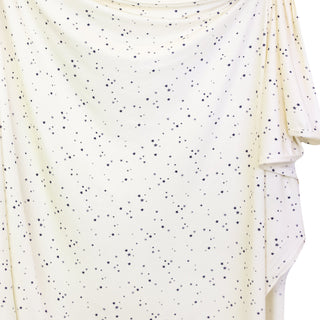 Lou Lou and Company Swaddle Blanket - George
White long-sleeve shirt with black speckles on a white background